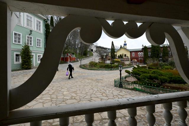 People visit the Pskovo-Pechersky monastery in the town of Pechory, some 50 kilometres outside Pskov, on April 19, 2026. (Photo by Olga MALTSEVA / AFP)