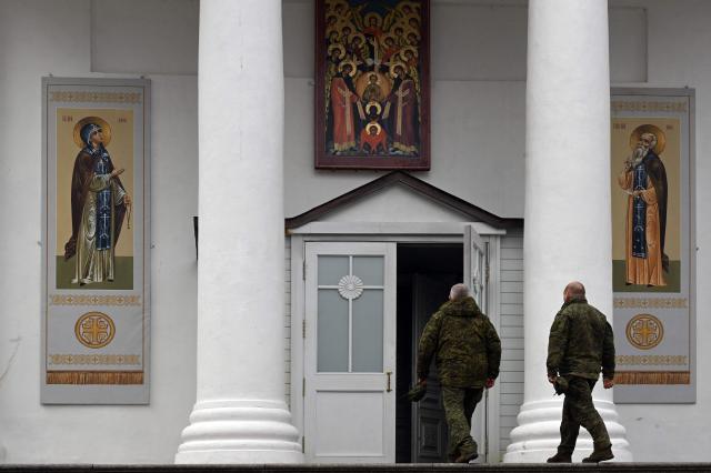 Russian servicemen visit the Pskovo-Pechersky monastery in the town of Pechory, some 50 kilometres outside Pskov, on April 19, 2026. (Photo by Olga MALTSEVA / AFP)