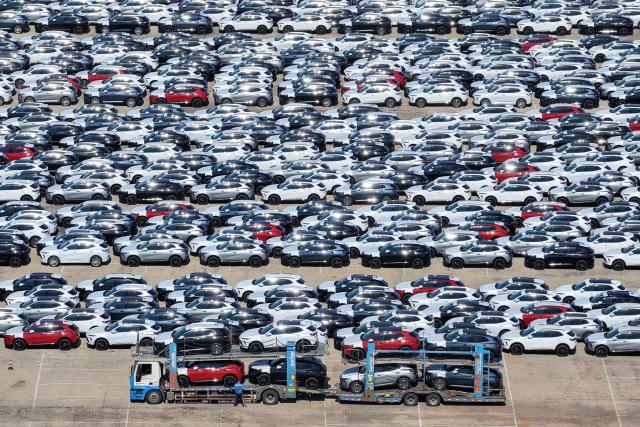 Chinese-made cars are parked at a port in Yantai, in China’s eastern Shandong province on June 11, 2026. (Photo by CN-STR / AFP) / China OUT