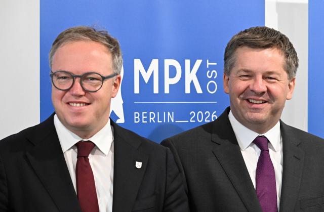 Saxony-Anhalt's State Premier Sven Schulze (R) and Thuringia's State Premier Mario Voigt arrive for a conference of the state leaders of Germany's eastern federal states in Schoenefeld, southeast of Berlin, on June 11, 2026. (Photo by RALF HIRSCHBERGER / AFP)