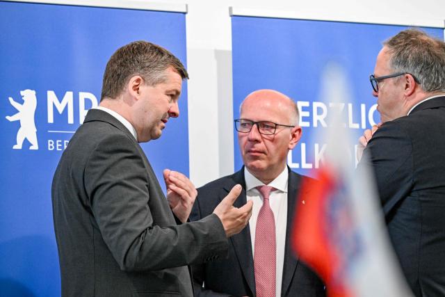 Saxony-Anhalt's State Premier Sven Schulze (L), Berlin mayor Kai Wegner (C) and Thuringia's State Premier Mario Voigt arrive for a conference of the state leaders of Germany's eastern federal states in Schoenefeld, southeast of Berlin, on June 11, 2026. (Photo by RALF HIRSCHBERGER / AFP)