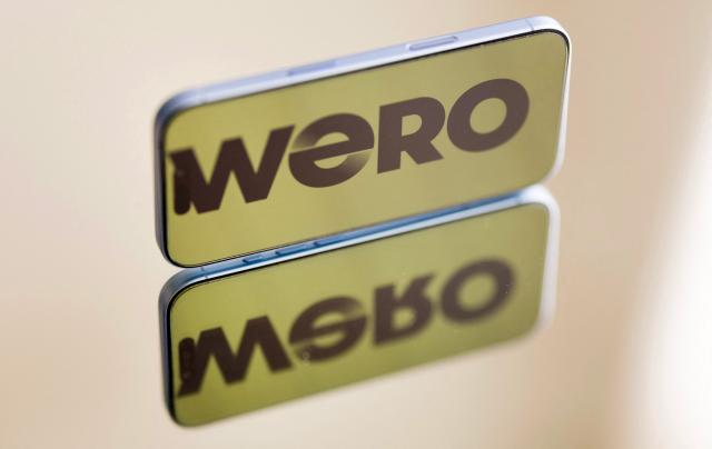 This photograph shows the logo of European paiement mobile system 'Wero' displayed on a smartphone in Quimper, western France on June 11, 2026. Wero is an European service of payment that aloows an instant payment between individuals with a number of mobile phone or QR code. (Photo by Fred TANNEAU / AFP)