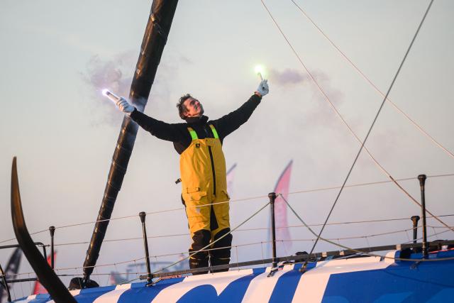 (FILES) French skipper Charlie Dalin celebrates aboard his Imoca 60 monohull "Macif" after crossing the finish line of the 10th edition of the Vendee Globe around the world monohull solo sailing race, off the coast of Les Sables-d'Olonne, western France, on January 14, 2025. French offshore sailor and Vendee Globe 2024/2025 winner Charlie Dalin has died in Quimper, western France, aged 42, from cancer, his family announced on June 11, 2026. (Photo by Loic VENANCE / AFP)