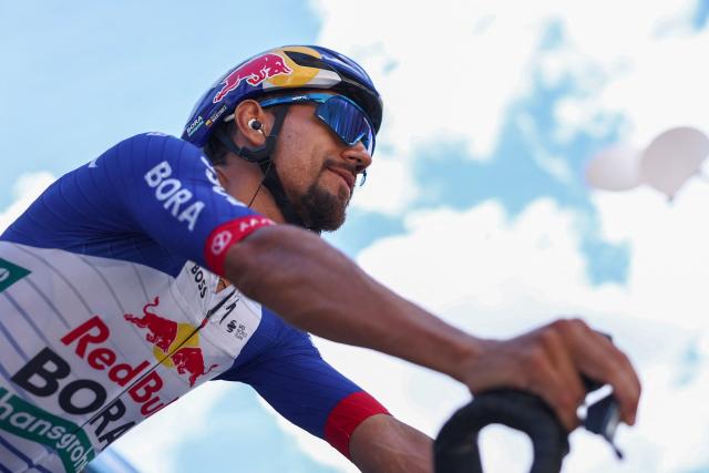 Red Bull - Bora - Hansgrohe's Colombian rider Daniel Felipe Martinez Poveda reacts ahead of the start of the 5th stage of the Tour Auvergne-Rhone-Alpes cycling race (formerly known as the Criterium du Dauphine), 195,8km between Saint-Chamond and Villars-les-Dombes, central France, on June 11, 2026. (Photo by Anne-Christine POUJOULAT / AFP)