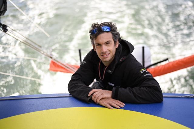 (FILES) French skipper Charlie Dalin poses for a picture aboard his Imoca monohull « MACIF », off Lorient, western France, a few months ahead of the Vendee Globe around-the-world solo sailing race, on April 22, 2024. French offshore sailor and Vendee Globe 2024/2025 winner Charlie Dalin has died in Quimper, western France, aged 42, from cancer, his family announced on June 11, 2026. (Photo by Sebastien SALOM-GOMIS / AFP)