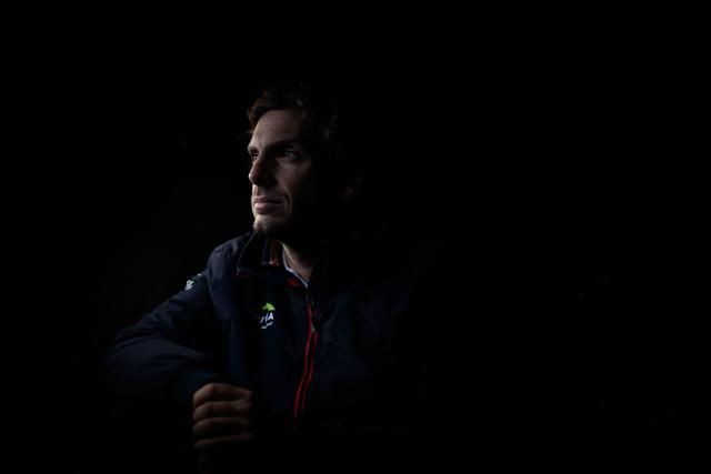 (FILES) French skipper Charlie Dalin poses onboard his Imoca 60 monohull Apivia at the 'Village de Saint-Malo', the start point of the Route du Rhum solo sailing race, in Saint-Malo, northern France on November 3, 2022. French offshore sailor and Vendee Globe 2024/2025 winner Charlie Dalin has died in Quimper, western France, aged 42, from cancer, his family announced on June 11, 2026. (Photo by LOIC VENANCE / AFP)