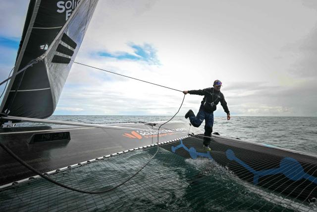 French skipper Thibaut Vauchel-Camus sails his Ocean Fify multihull "Solidaires en Peloton" during a convoying from Saint-Malo, Britany, to Fecamp, Normandyas part of his preparation for the Route du Rhum solo transatlantic sailing race , on June 10, 2026.
The start of the 13rd edition of the Route du Rhum is scheduled for November 1, 2026.. The 13th Route du Rhum will start from Saint-Malo to Pointe-a-Pitre, French Caribbeans, on November 1, 2026. (Photo by Lou BENOIST / AFP)