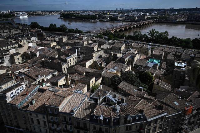 This photograph taken from the top of the restored Saint-Michel bell tower shows the Pont de Pierre over the Garonne river in Bordeaux, southwestern France on June 11, 2026. The 114-meter high Saint-Michel, built at the end of the 15th century, is set to reopen to the public on June 13 following five years of restoration. (Photo by Christophe ARCHAMBAULT / AFP)