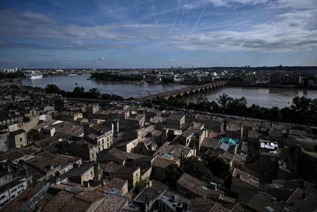 This photograph taken from the top of the restored Saint-Michel bell tower shows the Pont de Pierre over the Garonne river in Bordeaux, southwestern France on June 11, 2026. The 114-meter high Saint-Michel, built at the end of the 15th century, is set to reopen to the public on June 13 following five years of restoration. (Photo by Christophe ARCHAMBAULT / AFP)