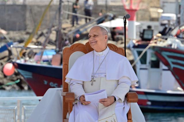 Pope Leo XIV smiles during a meeting with organizations working with migrants in the port of Arguineguin on the Canary Island of Gran Canaria, a place accustomed to the arrival of migrants, on June 11, 2026. Pope Leo XIV is visiting Spain June 6-12 with stops in Madrid, Barcelona, and the Canary Islands, where he will meet with migrants and organisations dedicated to helping them. (Photo by Stefano RELLANDINI / AFP)