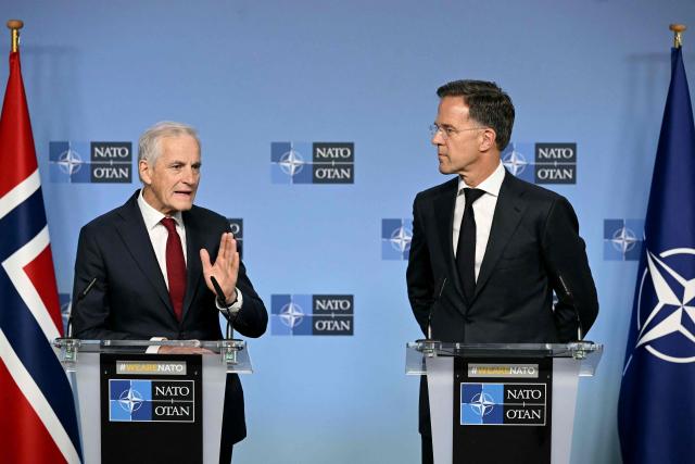 NATO Secretary General Mark Rutte (R) and Norway's Prime Minister Jonas Gahr Store (L) hold a joint press conference during their meeting at NATO's headquarters in Brusssels on June 11, 2026. (Photo by NICOLAS TUCAT / AFP)