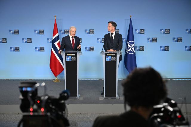 NATO Secretary General Mark Rutte (R) and Norway's Prime Minister Jonas Gahr Store (L) hold a joint press conference during their meeting at NATO's headquarters in Brusssels on June 11, 2026. (Photo by Nicolas TUCAT / AFP)