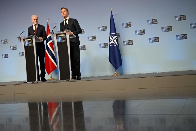 NATO Secretary General Mark Rutte (R) and Norway's Prime Minister Jonas Gahr Store (L) hold a joint press conference during their meeting at NATO's headquarters in Brusssels on June 11, 2026. (Photo by Nicolas TUCAT / AFP)