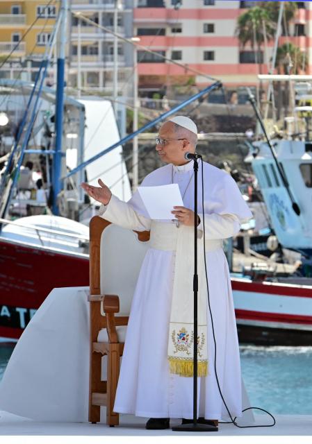 Pope Leo XIV delivers a speech during a meeting with organizations working with migrants in the port of Arguineguin on the Canary Island of Gran Canaria, a place accustomed to the arrival of migrants, on June 11, 2026. Pope Leo XIV is visiting Spain June 6-12 with stops in Madrid, Barcelona, and the Canary Islands, where he will meet with migrants and organisations dedicated to helping them. (Photo by Stefano RELLANDINI / AFP)