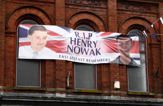 A poster in remembrance of stabbing victim Henry Nowak, killed in Southampton in December 2025, is pictured in Newtownards, east of Belfast, Northern Ireland, on June 11, 2026, following two consecutive nights of violence following the June 8 stabbing of Stephen Ogilvie, that triggered the unrest. Police arrested 16 people during a second night of disorder on June 10, in Northern Ireland sparked by the brutal Belfast stabbing of Stephen Ogilvie, a senior minister said Thursday, condemning rioters for "racist thuggery". (Photo by Henry NICHOLLS / AFP)