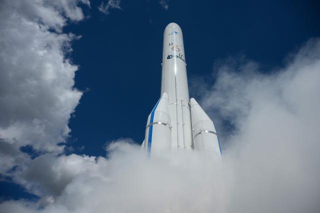 A Ariane 6 rocket of the European Space Agency (ESA) is engulfed in smoke from a smoke machine during a launch simulation the BER Airport in Schoenefeld, southeast of Berlin, on June 11, 2026, during the International Aerospace Exhibition (ILA). (Photo by RALF HIRSCHBERGER / AFP)