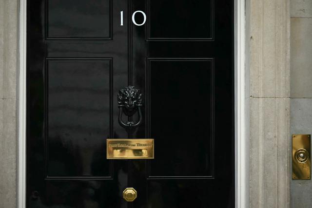 The door to 10 Downing Street, the official residence of Britain's Prime Minister, is pictured in central London on June 11, 2026. British Defence Secretary John Healey resigned on June 11, 2026, in a shock move which he blamed on Prime Minister Keir Starmer and the finance ministry failing to commit sufficient resources to defence investment. (Photo by Ben STANSALL / AFP)