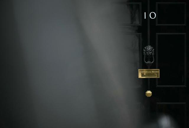 The door to 10 Downing Street, the official residence of Britain's Prime Minister, is pictured in central London on June 11, 2026. British Defence Secretary John Healey resigned on June 11, 2026, in a shock move which he blamed on Prime Minister Keir Starmer and the finance ministry failing to commit sufficient resources to defence investment. (Photo by Ben STANSALL / AFP)