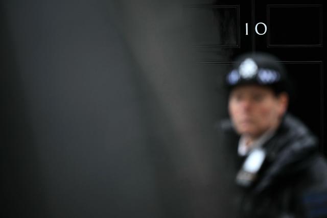 A police officer stands outside 10 Downing Street, the official residence of Britain's Prime Minister, in central London on June 11, 2026. British Defence Secretary John Healey resigned on June 11, 2026, in a shock move which he blamed on Prime Minister Keir Starmer and the finance ministry failing to commit sufficient resources to defence investment. (Photo by Ben STANSALL / AFP)