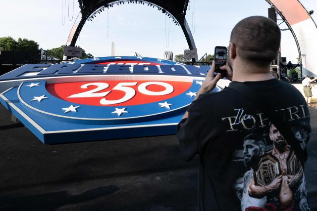 A "UFC Freedom 250" logo and the structure, known as "The Claw," for the upcoming UFC fight that US President Donald Trump will host as part of the 250th anniversary of the United States is seen on the South Lawn of the White House during a media preview in Washington, DC, June 11, 2026. The Ultimate Fighting Championship (UFC) event will be held on US President Donald Trump's 80th birthday on June 14. (Photo by SAUL LOEB / AFP)