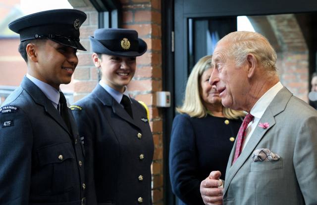 Britain's King Charles III (R) meets members of the Air Training Corps during a visit to Horizon Youth Zone, a new centre aimed at providing a safe and inspiring place for young people and offering multiple activities including sports, cooking, creative and performing arts, in the city of Grimsby, north-east England, on June 11, 2026. (Photo by Temilade Adelaja / POOL / AFP)
