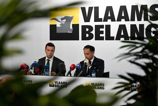 French far-right Rassemblement National RN party's President and Member of the European Parliament (MEP) Jordan Bardella (L) speaks flanked by President of Belgian and Flemish far-right party Vlaams Belang (VB) Tom Van Grieken as they hold a press briefing at the headquarters of Belgian and Flemish far-right party Vlaams Belang as part of Bardella's meeting with Flemish far-right representatives in Brussels on June 11, 2026, a new opportunity to strengthen his European alliances just a few months before the upcoming French presidential election. (Photo by NICOLAS TUCAT / AFP)