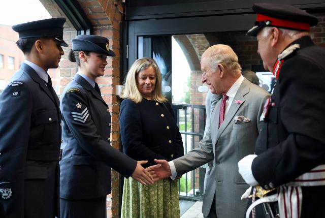 Britain's King Charles III (2R) meets members of the Air Training Corps during a visit to Horizon Youth Zone, a new centre aimed at providing a safe and inspiring place for young people and offering multiple activities including sports, cooking, creative and performing arts, in the city of Grimsby, north-east England, on June 11, 2026. (Photo by Temilade Adelaja / POOL / AFP)