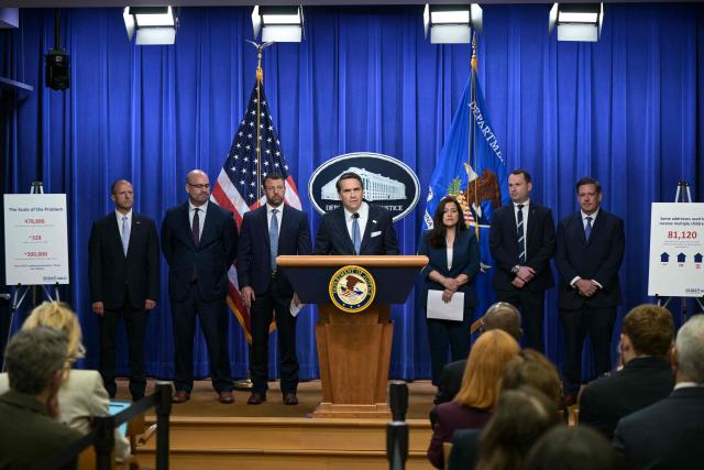 US Acting Attorney General Todd Blanche (C), alongside Secretary of Homeland Security Markwayne Mullin (3L), speaks during a press conference about safeguarding unaccompanied immigrant children at the Department of Justice headquarters in Washington, DC, on June 11, 2026. (Photo by Oliver Contreras / AFP)