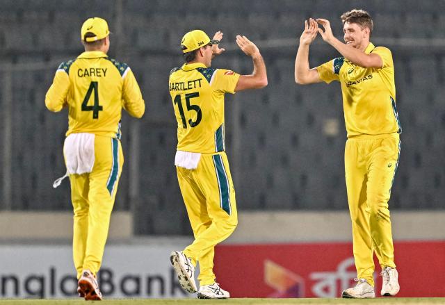 Australia's Cameron Green (R) celebrates with teammates after taking the wicket of Bangladesh's Litton Das during the second one-day international (ODI) cricket match between Bangladesh and Australia at the Sher-e-Bangla National Stadium in Dhaka on June 11, 2026. (Photo by MUNIR UZ ZAMAN / AFP)