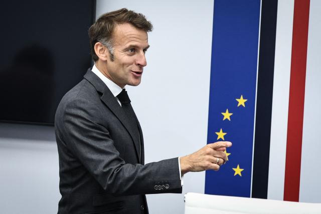 France's President Emmanuel Macron gestures as he arrives to chair a videoconference meeting dubbed "Global Convergence for Growth Summit" with officials and head of states from China and G7 members states, at the Elysee Presidential Palace in Paris on June 11, 2026. (Photo by SIMON WOHLFAHRT / POOL / AFP)