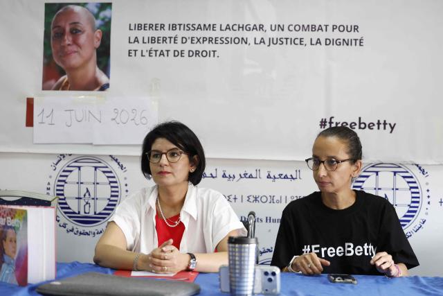 The sister of Ibtissame Lachgar, Siham Lachgar (R) attends a press conference with her sister's lawyer Ghizlane Mamouni (L) to speak on her critical health condition at the headquarters of the Moroccan Association for Human Rights (AMDH) in Rabat on June 11, 2026. A Moroccan court on September 3, sentenced activist Ibtissame Lachgar to 30 months behind bars for "offending Islam" by wearing a T-shirt with inscriptions deemed "blasphemous". (Photo by Abdel Majid BZIOUAT / AFP)