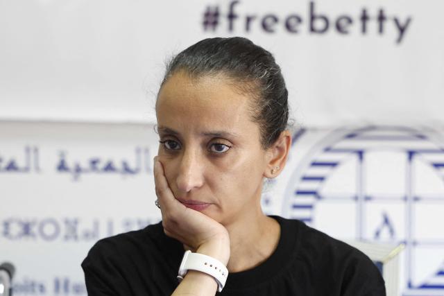 The sister of Ibtissame Lachgar, Siham Lachgar attends a a press conference to speak on her critical health condition at the headquarters of the Moroccan Association for Human Rights (AMDH) in Rabat on June 11, 2026. A Moroccan court on September 3, sentenced activist Ibtissame Lachgar to 30 months behind bars for "offending Islam" by wearing a T-shirt with inscriptions deemed "blasphemous". (Photo by Abdelmajid BZIOUAT / AFP)