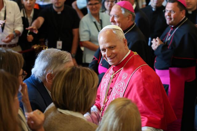 Pope Leo XIV greets people during a meeting with bishops, priests, deacons, religious, seminarians and pastoral workers in the cathedral of Saint Anne in Las Palmas on the Canary Island of Gran Canaria, a place accustomed to the arrival of migrants, on June 11, 2026. Pope Leo XIV is visiting Spain June 6-12 with stops in Madrid, Barcelona, and the Canary Islands, where he will meet with migrants and organisations dedicated to helping them. (Photo by Jaime REINA / AFP)