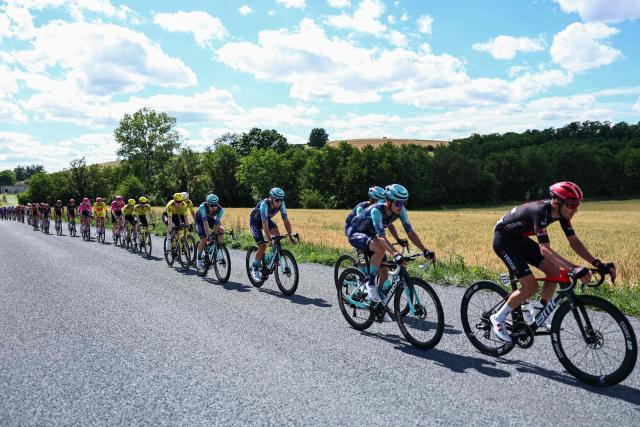 The pack of riders cycles during the 5th stage of the Tour Auvergne-Rhone-Alpes cycling race (formerly known as the Criterium du Dauphine), 195,8km between Saint-Chamond and Villars-les-Dombes, central France, on June 11, 2026. (Photo by Anne-Christine POUJOULAT / AFP)