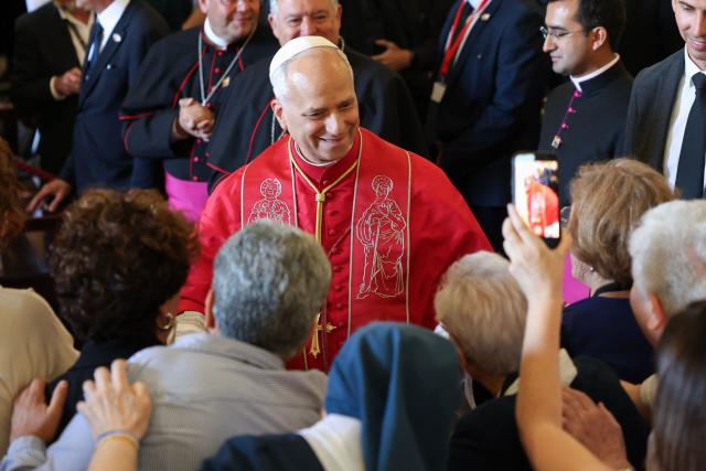 Pope Leo XIV greets people during a meeting with bishops, priests, deacons, religious, seminarians and pastoral workers in the cathedral of Saint Anne in Las Palmas on the Canary Island of Gran Canaria, a place accustomed to the arrival of migrants, on June 11, 2026. Pope Leo XIV is visiting Spain June 6-12 with stops in Madrid, Barcelona, and the Canary Islands, where he will meet with migrants and organisations dedicated to helping them. (Photo by Jaime REINA / AFP)