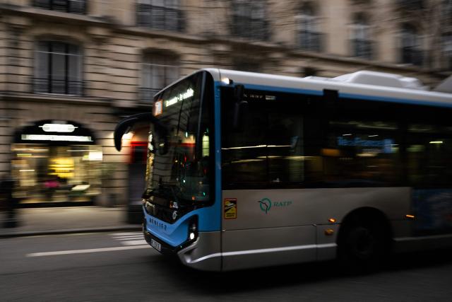 (FILES) This slow shutter speed photograph shows a Paris public transport RATP bus driving in Paris on January 9, 2026. (Photo by Julie SEBADELHA / AFP)