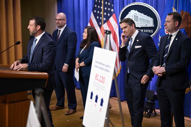 US Secretary of Homeland Security Markwayne Mullin (L) speaks as Acting Attorney General Todd Blanche (2R) looks on during a press conference about safeguarding unaccompanied immigrant children at the Department of Justice headquarters in Washington, DC, on June 11, 2026. (Photo by Oliver Contreras / AFP)
