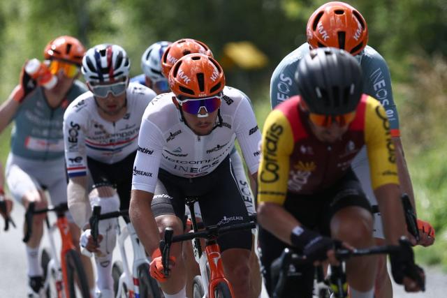 Netcompany Ineos Cycling Team's French rider Kévin Vauquelin (C) wearing the best young rider's white jersey cycles during the 5th stage of the Tour Auvergne-Rhone-Alpes cycling race (formerly known as the Criterium du Dauphine), 195,8km between Saint-Chamond and Villars-les-Dombes, central France, on June 11, 2026. (Photo by Anne-Christine POUJOULAT / AFP)