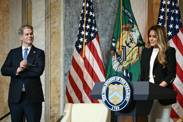 (L/R) US Treasury Secretary Scott Bessent looks on as First Lady Melania Trump speaks during an event to launch "Fostering the Future Accounts," a new financial vehicle for youth in foster care, at the Treasury Building in Washington, DC, on June 11, 2026. (Photo by Brendan SMIALOWSKI / AFP)