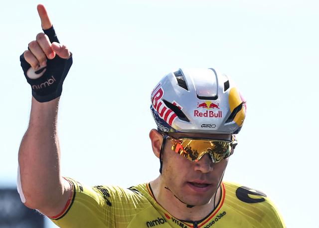 Team Visma | Lease a Bike's Belgian rider Wout Van Aert celebrates crossing the finish line to win the 5th stage of the Tour Auvergne-Rhone-Alpes cycling race (formerly known as the Criterium du Dauphine), 195,8km between Saint-Chamond and Villars-les-Dombes, central France, on June 11, 2026. (Photo by Anne-Christine POUJOULAT / AFP)