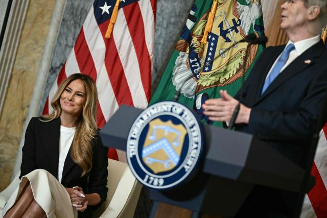 US First Lady Melania Trump (L) looks on as Treasury Secretary Scott Bessent (R) speaks during an event to launch "Fostering the Future Accounts," a new financial vehicle for youth in foster care, at the Treasury Building in Washington, DC, on June 11, 2026. (Photo by Brendan SMIALOWSKI / AFP)