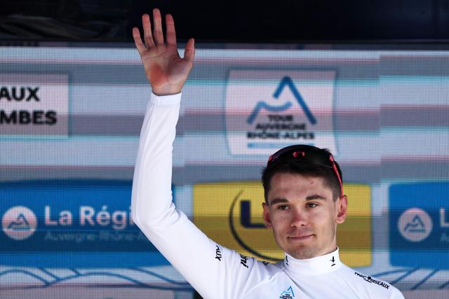 EF Education - EasyPost's French rider Alex Baudin celebrates wearing the best young rider's white jersey on the podium of the 5th stage of the Tour Auvergne-Rhone-Alpes cycling race (formerly known as the Criterium du Dauphine), 195,8km between Saint-Chamond and Villars-les-Dombes, central France, on June 11, 2026. (Photo by Anne-Christine POUJOULAT / AFP)