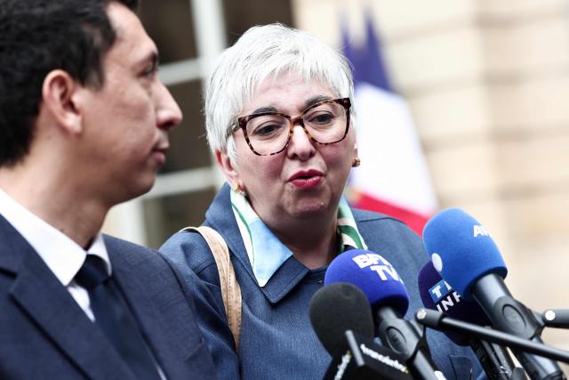 French right-wing party Les Republicains (LR) general secretary Othman Nasrou a (L) and LR MP Muriel Jourda speak to the press as they leave after attending a meeting with France's Prime Minister gathering several political parties and security institutions representatives on safeguarding democratic debates against foreign interference, at the Matignon Hotel in Paris on June 11, 2026. Paris prosecutors opened in May a probe to investigate whether an Israeli company interfered in local French elections. The case was opened after several far-left candidates charged they were targeted by disinformation campaigns, as France's government body responsible for combatting online disinformation Viginum said that it had noted a "system of artificial or automated dissemination to spread manifestly inaccurate or misleading content". (Photo by Behrouz MEHRI / AFP)
