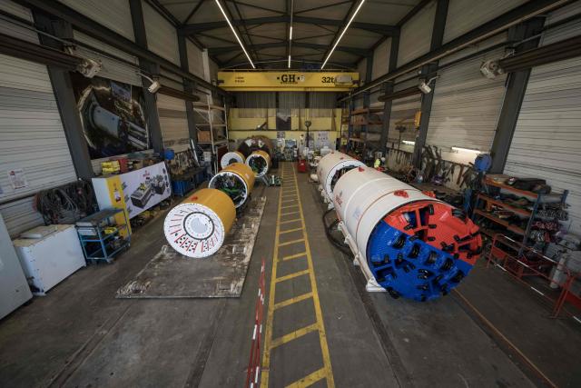 A photograph taken on June 11, 2026 shows tunnelling machines displayed during a media tour of BESSAC, a company specializing in the construction of tunnels and micro-tunnels, at their plant in Saint-Jory, near Toulouse, southwestern France. (Photo by Ed JONES / AFP)
