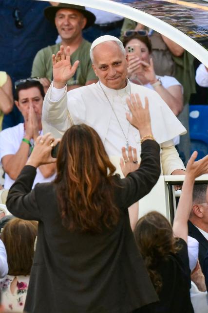 Pope Leo XIV waves to people as he enters the Gran Canaria Stadium to lead a Holy mass in Las Palmas on the island of Gran Canaria, in Spain's Canary Islands, a place accustomed to the arrival of migrants, on June 11, 2026. Pope Leo XIV is visiting Spain June 6-12 with stops in Madrid, Barcelona, and the Canary Islands, where he will meet with migrants and organisations dedicated to helping them. (Photo by Stefano RELLANDINI / AFP)