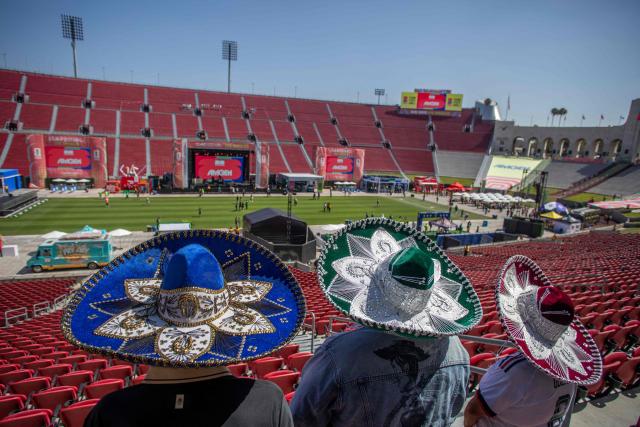 Mexican fans arrive at the LA Memorial Colesium Stadium for a watch party for the 2026 FIFA World Cup opening match between Mexico and South Africa at the FIFA Fan Festival in Los Angeles, California, on June 11, 2026. Mexico and South Africa are opening the 2026 FIFA World Cup in Mexico City. (Photo by Apu GOMES / AFP)