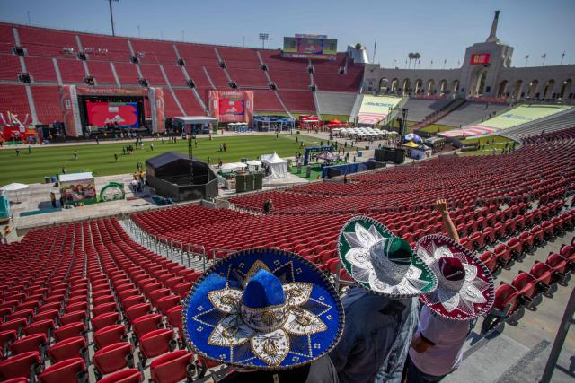 Mexican fans arrive at the LA Memorial Colesium Stadium for a watch party for the 2026 FIFA World Cup opening match between Mexico and South Africa at the FIFA Fan Festival in Los Angeles, California, on June 11, 2026. Mexico and South Africa are opening the 2026 FIFA World Cup in Mexico City. (Photo by Apu GOMES / AFP)