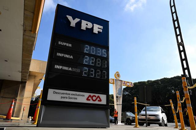 A fuel price board is seen at a gas station in Buenos Aires on June 11, 2026. (Photo by Luis ROBAYO / AFP)