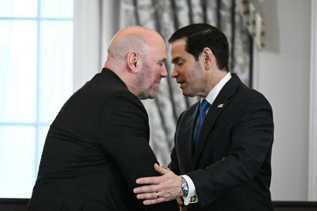 (L/R) UFC President and CEO Dana White and US Secretary of State Marco Rubio shake hands as htey participate in a Memorandum of Understanding signing ceremony at the State Department in Washington, DC, on June 11, 2026. According to the State Department, the new partnership aims to "enhance sports diplomacy initiatives and collaborate on the global growth of mixed martial arts." (Photo by Brendan SMIALOWSKI / AFP)