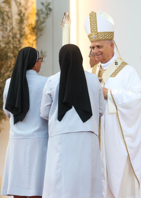 Pope Leo XIV leads a Holy mass at the Gran Canaria Stadium in Las Palmas on the Canary Island of Gran Canaria on June 11, 2026. Pope Leo XIV is visiting Spain June 6-12 with stops in Madrid, Barcelona, and the Canary Islands, where he will meet with migrants and organisations dedicated to helping them. (Photo by Pierre-Philippe MARCOU / AFP)